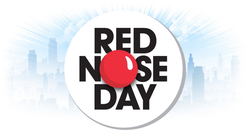 A red button with the words " red nose day ".