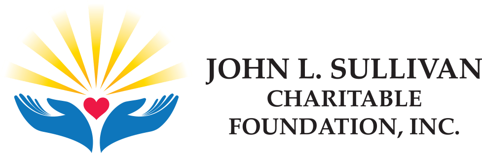 A green background with the words john laing charitable foundation in black.